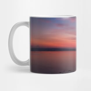 Silhouetted rock stack at a red sunset beach Mug